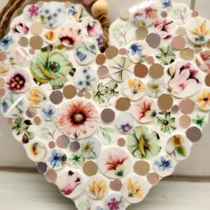 Mosaic heart made with individually hand cut glass and ceramic tiles, and vintage chin.