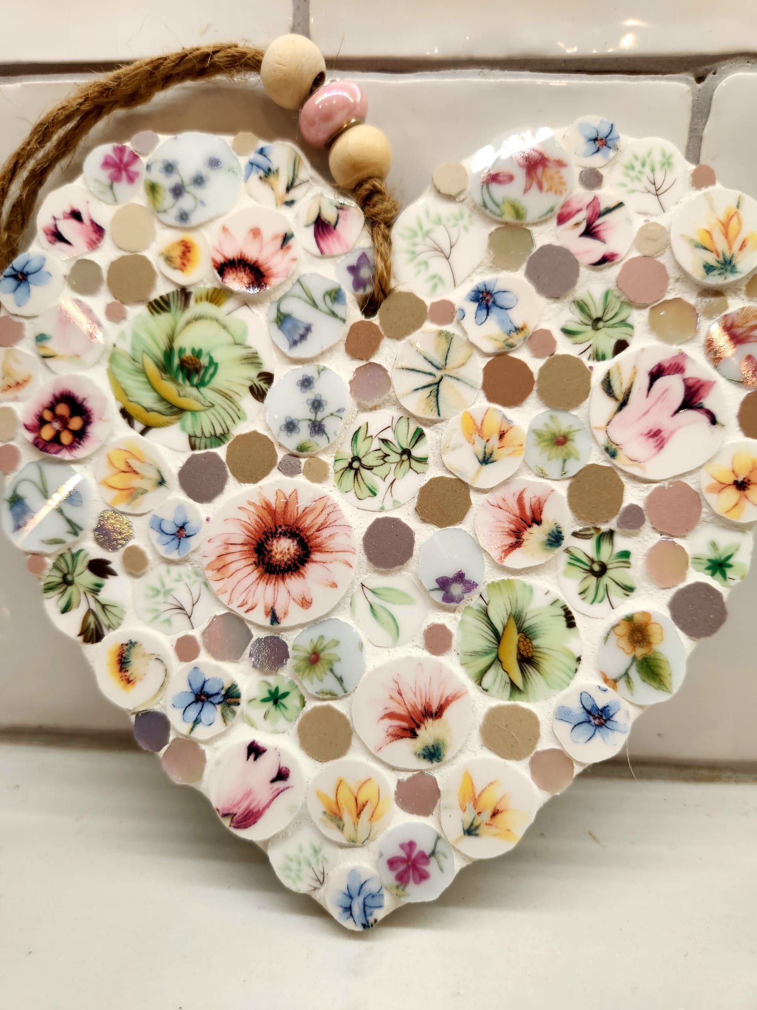 Mosaic heart made with individually hand cut glass and ceramic tiles, and vintage chin.